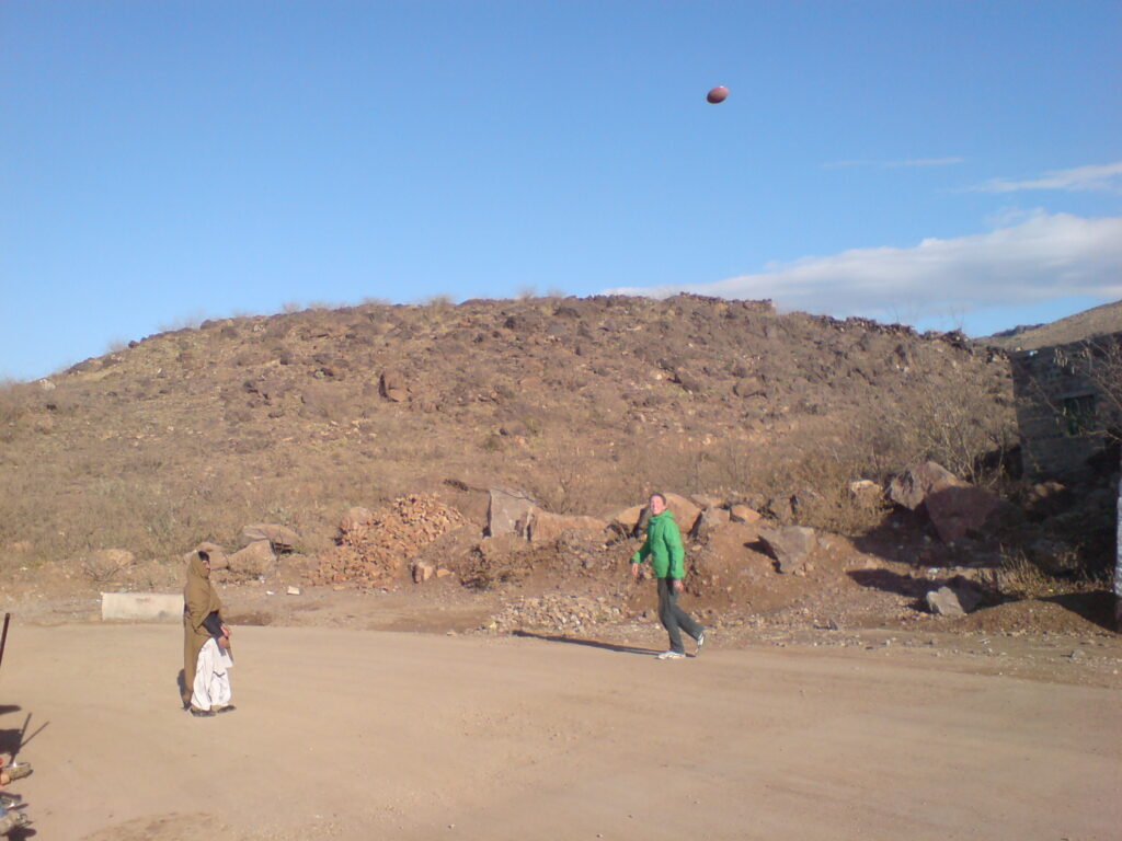 Playing ball with locals while we wait